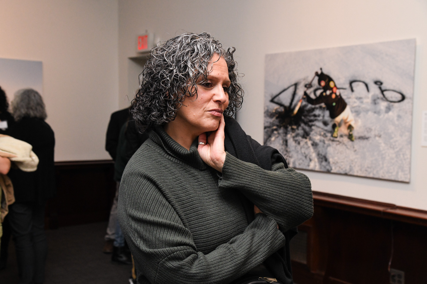 Woman looking at art