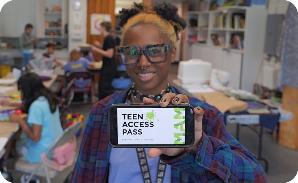 Teen holding up their phone and the screen says "TEEN ACCESS PASS"