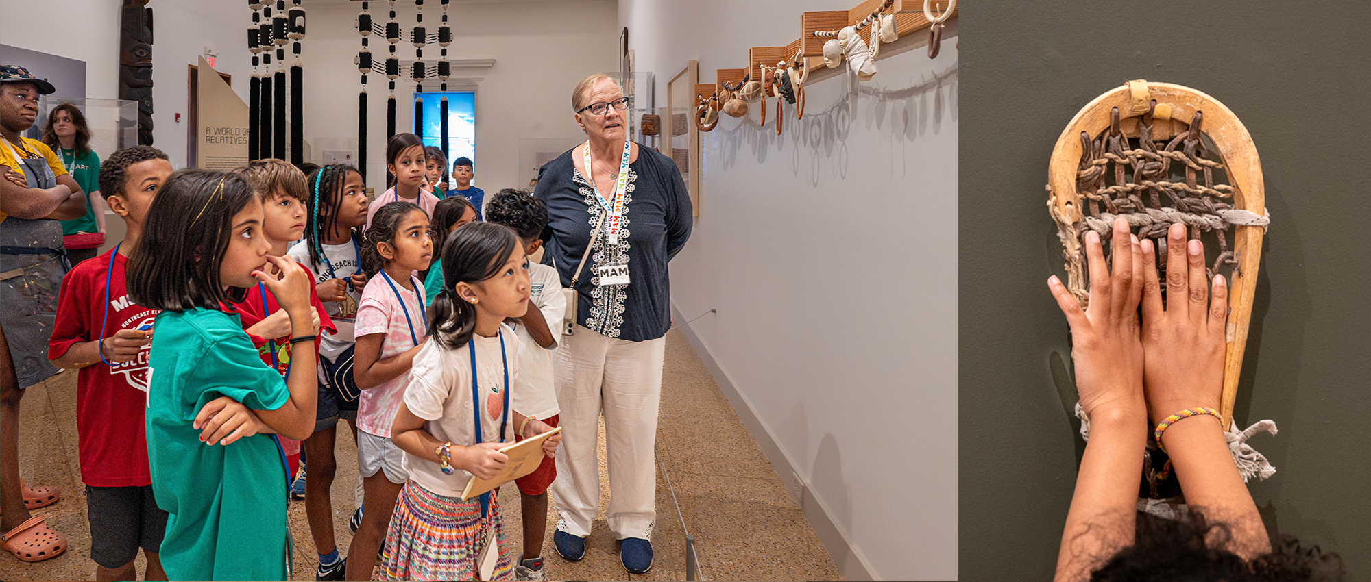 A group of children learns about art in a gallery, while one child's hand touches a woven artifact mounted on the wall.