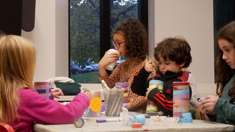 Group of children participating in MAM's rattle-making workshop