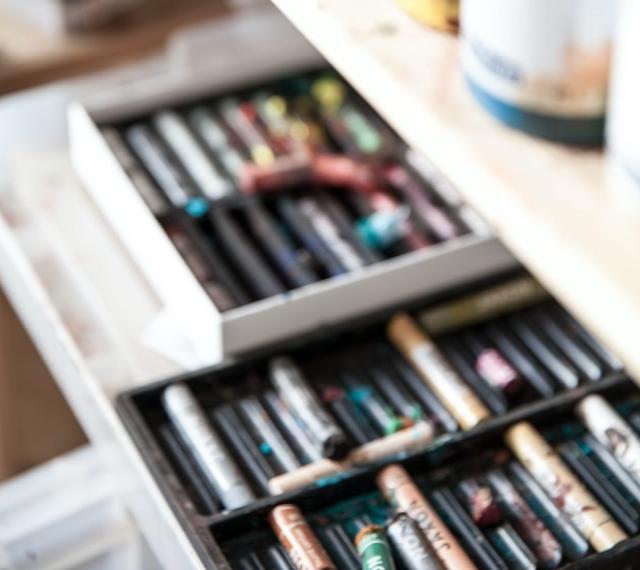 oil pastels in their trays.