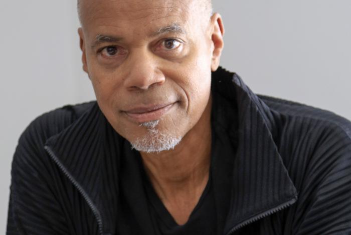 A portrait of Todd Gray wearing a black jacket.