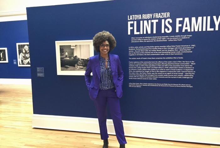 LaToya Ruby Frazier in front of intro panel for her exhibition of photo essay Flint is Family.
