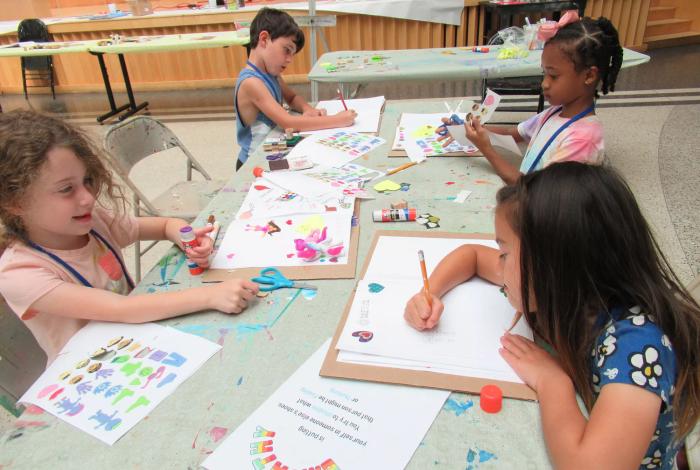 Children drawing as they partake in SummerART