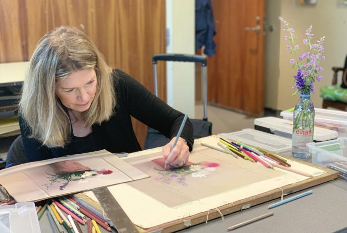Adult student drawing a pot of flowers